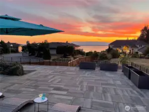 Outdoor Terraces: Raised the yard to be level and added a large tile terrace with cement walls to allow stellar water views & planted a bamboo wall to give more privacy.