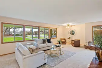View of the expansive front lawn and peek-a-book view of American Lake.