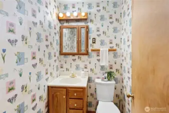 Half bath located in the main hallway.