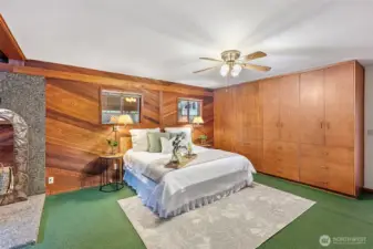 The primary bedroom is one of a kind. With cedar walls, built in storage, 2 walk in closets and a unique bathroom with sitting area, you might never leave!