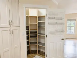 Updated & modernized kitchen with stone counter tops, large island, gas appliances, Walk in pantry & pot filling faucet above the cookstove. #11823 150th St Ct E, Puyallup, WA 98374