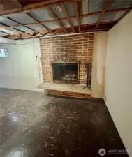 Wood burning fireplace on the lower level.