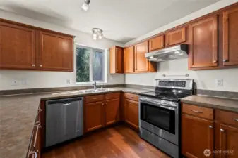 The kitchen provides plenty of countertop space and storage