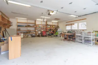 Very large garage has built-in shelves.