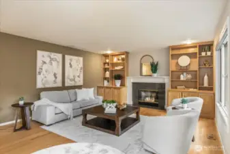 Cozy up to the gas fireplace on a cold evening or relax with a book in front of the wall of windows. The built in cabinets are great for extra storage as well.