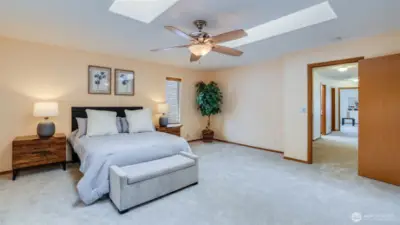 The primary bedroom provides an expansive layout, offering plenty of room for relaxation and personalization