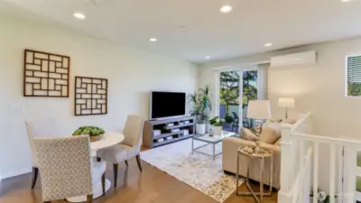 You see the room that can be used as a family or living room.  A large glass sliding door takes you to a spacious deck that is perfect for morning coffee or relax.