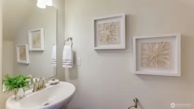 There is a convenient powder room on the condominium main floor.