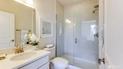 The primary bath has a large glass shower.  Well appointed and in excellent condition.