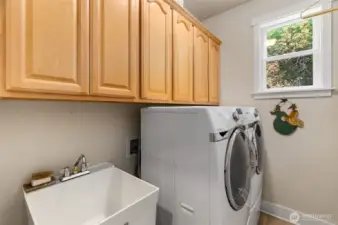 Laundry room with utility sink, lots of cabinet storage