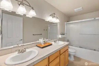 Shared full bath with double vanity, one sink for each kiddo