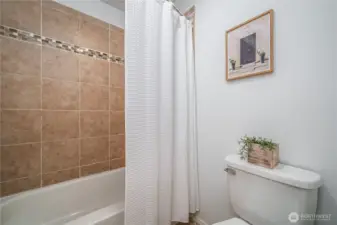...to the tiled floor and shower surround.