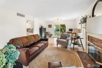 formal living, open to kitchen and slider to covered patio