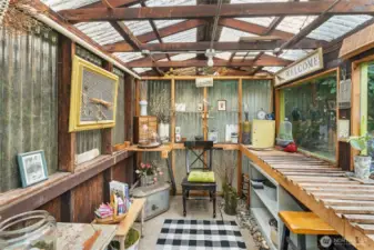 inside eclectic potting shed in rear yard