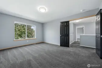 Large bonus room on upper floor with double door entry