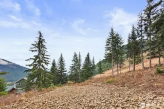 The groundwork is already in place. The lot is cleared and utilities (water, sewer, power) are at the street, water rights have been secured and paid for, and architectural blueprints, site plans and geo surveys are available for those ready to bring their mountain vision to life.