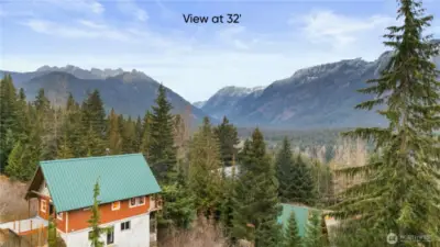 At thirty-two feet, on your upper floor, the mountains truly unfold. From here, the view soars all the way toward the iconic Chikamin Peak. It’s an elevated vantage rarely found on Snoqualmie Pass—wide, sweeping, and completely unobstructed. Perfect for a primary suite, a loft, or any space meant to inspire.