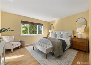 Primary bedroom is spacious, tree-house feel overlooking the backyard and greenbelt, very peaceful