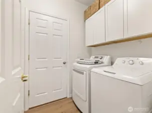 Main floor laundry room, access to the large 2 car garage