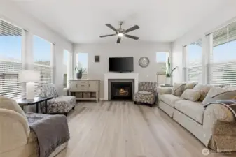 Windows on all sides with gas fireplace.