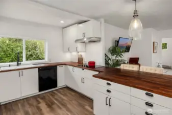 Butcher block countertops bring warmth into kitchen.