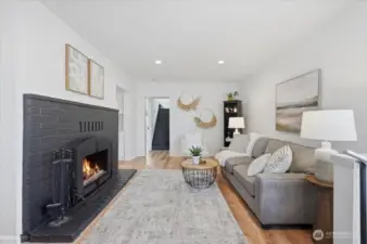 Upon entering you are greeted with a warm, large, cozy wood fireplace, inspected, cleaned and dormer replaced with new (2022).  New 20-Yr Lifeproof Luxury LVP flooring which is scratch resistant and water proof.