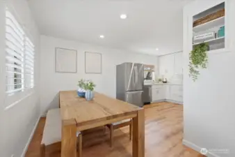 Nice size dining area currently showing seller's table which is available for purchase - please inquire.  It is substantial in both size & structure.  The room will open up to feel even larger with a smaller say 4 or 6 top, However this table is AMAZING!