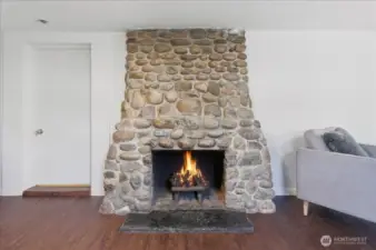 Show stopping Stone Fireplace offers such vintage character to this room