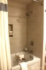 Lower bath, soaking tub with custom tile surround