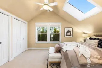 Upstairs primary boasts it's own skylight, ceiling fan and large closet space