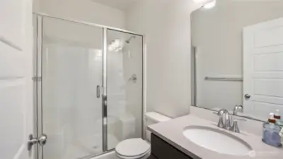 Convenient 3/4 bathroom downstairs—perfectly designed to welcome and accommodate your guests