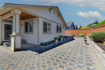 Extended expanded patio with raised beds.