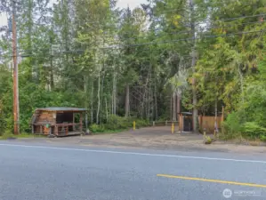 Entrance to property across the street to  beautiful  acreage that has been parked out and holds the septic and drainfield for the primary home and you can build a new home and expand the drainfield