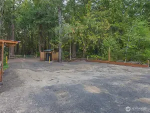 This property across the street is over an acre with a lush green belt behind the parcel. Open up a  or sell firewood to campers, lot's of opportunities. Even build a new home