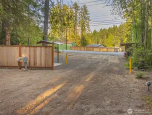 The view of the acreage entrance from across the street of the waterfront home