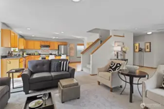 Looking from the corner towards the kitchen, stairs up to the bonus room & bedrooms