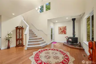 Soaring entry area with side door to gardens