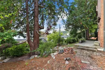 Charming brickwork along existing trails enhances the landscaping and guides you through the property’s outdoor spaces.