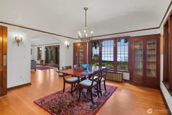 “Formal dining room adjacent to the living room, kitchen, and breakfast nook, creating a natural flow for entertaining and family gatherings.