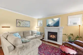 Main level living room with cozy fireplace.