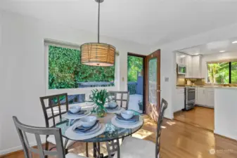 Dining area leads to expansive deak