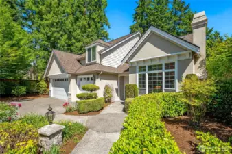 Another view of the front exterior, beautifully landscaped with an inviting walkway that beckons you inside.