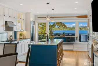 Wonderful chefs kitchen with custom bar and pass through