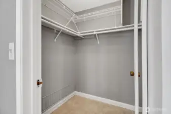 Walk in closet in primary bedroom
