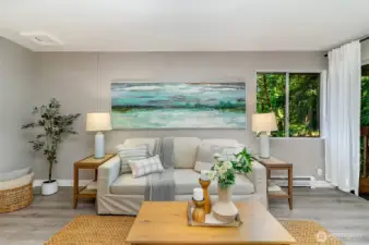 Enjoy the large living room w/ slider to the deck (right).