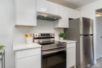 Just updated kitchen with new SS appliances, quartz counters & custom cabinitry!