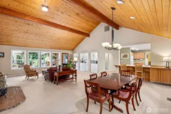 The open concept living/dining room features handsome knotty pine ceilings, 14" at the highest peak.