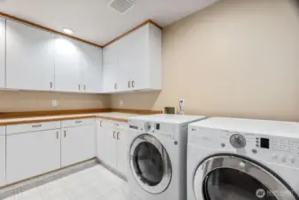 Spacious laundry room with lots of storage and room to fold