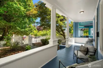 Thoughtfully positioned off the street, this freshly painted home offers a full length, shaded front porch for exceptional outdoor living. Shared driveway to off-street parking to the left/south.