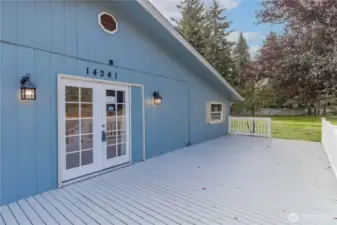 Large entertainment sized deck facing front lawn